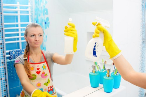 Technician preparing oven cleaning equipment in a Wimbledon kitchen