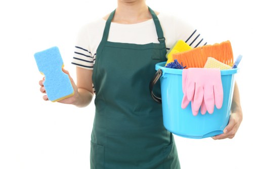 Photograph of an oven cleaner preparing equipment