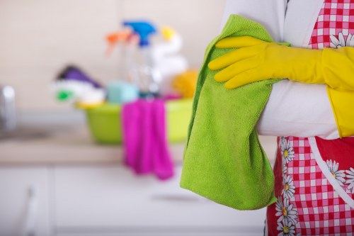 Technician performing hard floor and oven cleaning in Wimbledon