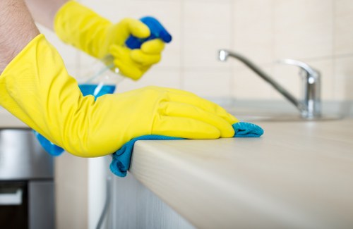 Technician preparing oven for cleaning in a Wimbledon kitchen